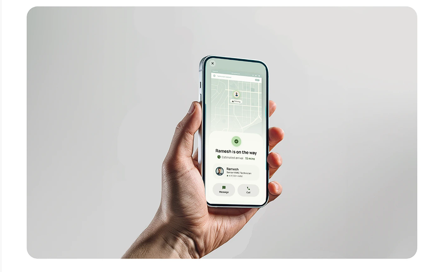 Hand holding smartphone showing live technician tracking status screen